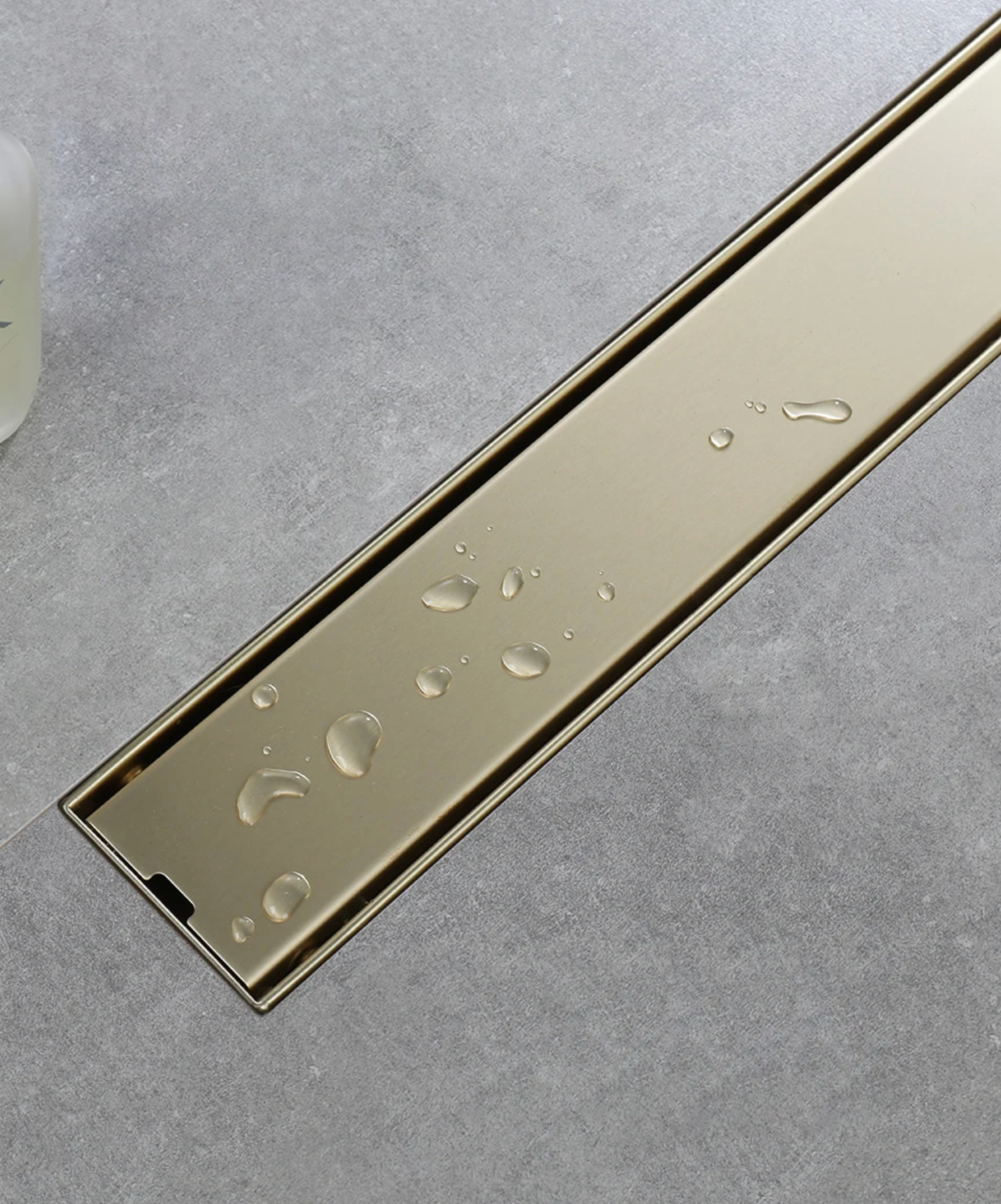 Caniveau de douche encastré or brossé