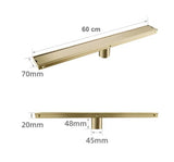 Caniveau de douche encastré or brossé